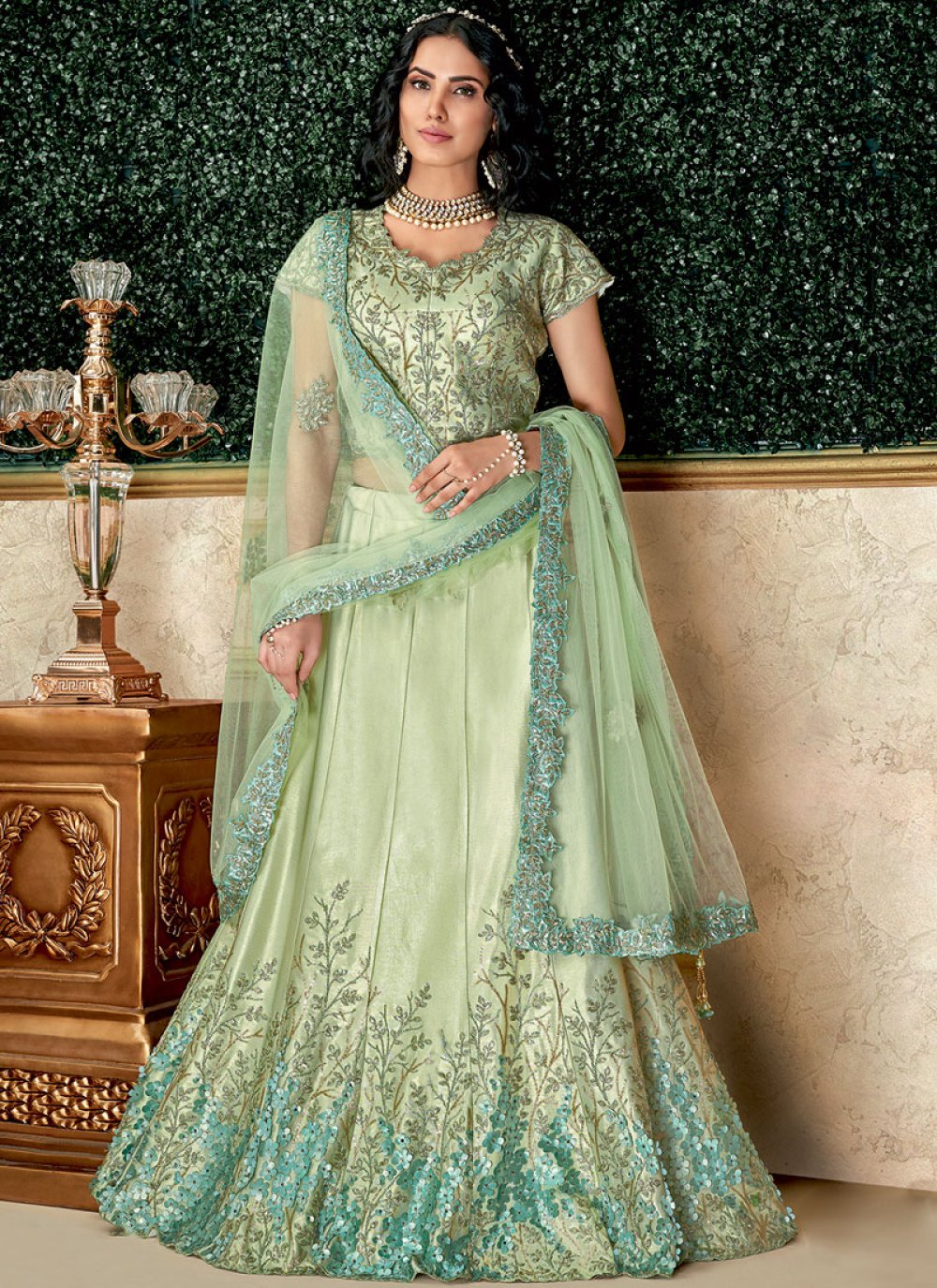 Photo of Bride in light green lehenga and floral jewellery