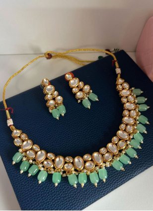 This Pista green Jewellery Set is Enhanced with Kundan