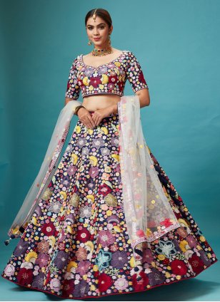Blue lehenga with multicolor floral jewelry for mehndi.