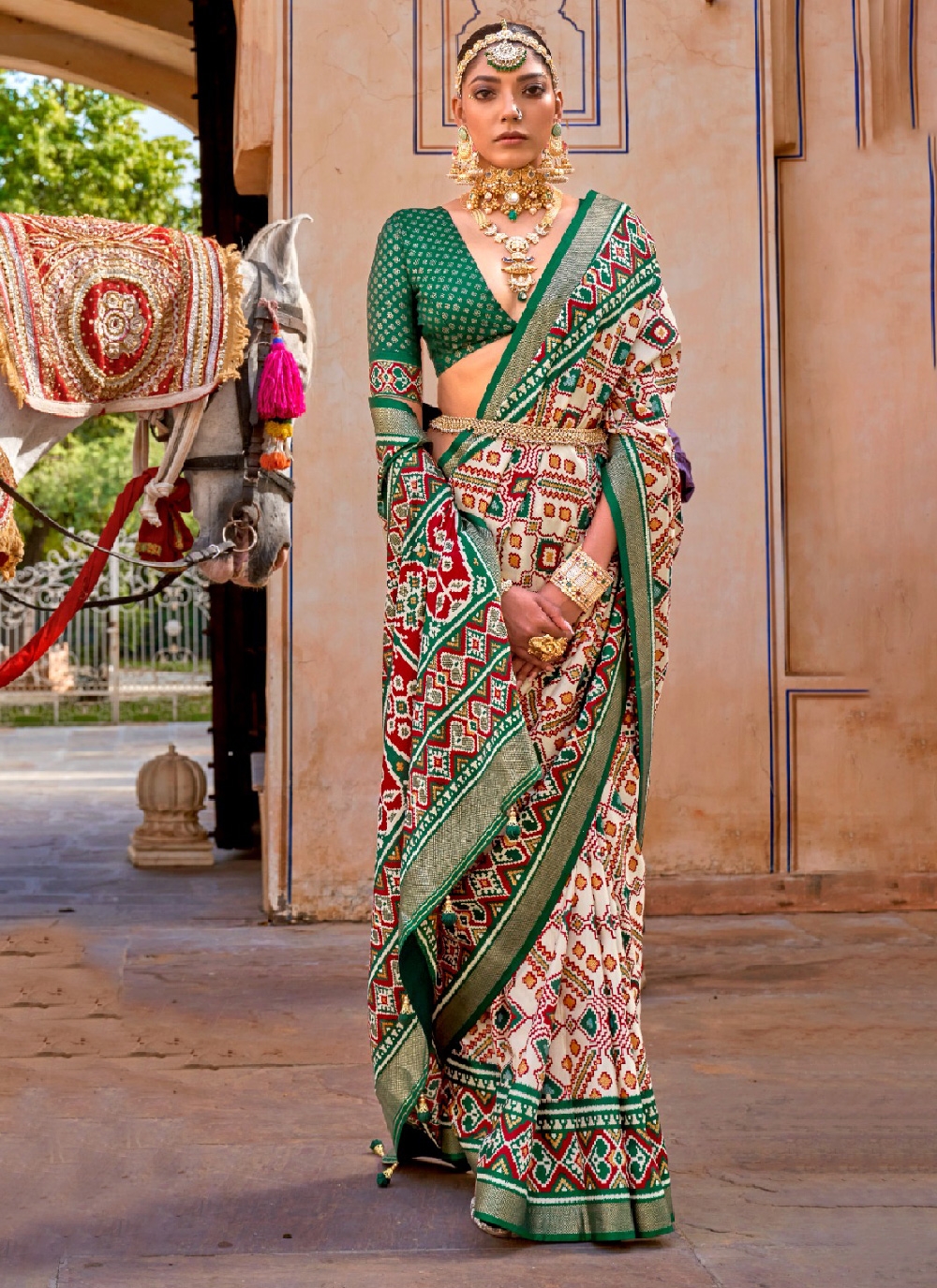 Check out the elegant Multi Colour Silk Patola Print Trendy Saree