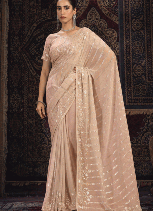 Peach color Georgette Traditional Saree with Fancy Work work