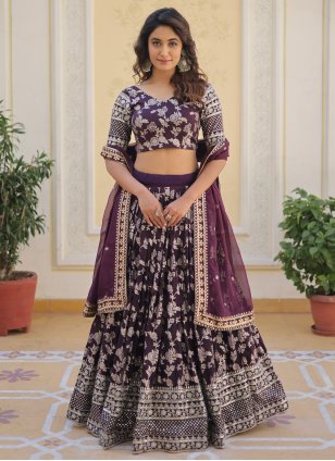 WINE MAGENTA HAND EMBROIDERED LEHENGA SET WITH SELF AND SILVER EMBROIDERY  PAIRED WITH A MATCHING DUPATTA AND CUT WORK NECKLINE. - Seasons India